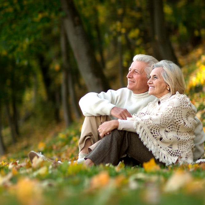 Older couple sitting in nature