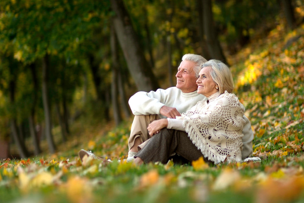 Older couple sitting in nature